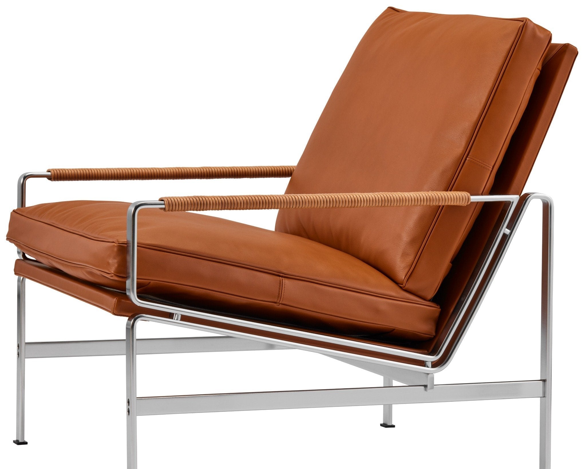 Fauteuil FK 6720 Easy Chair par Preben Fabricius et Jørgen Kastholm, légèreté visuelle et assise enveloppante, associant acier chromé et cuir aniline.