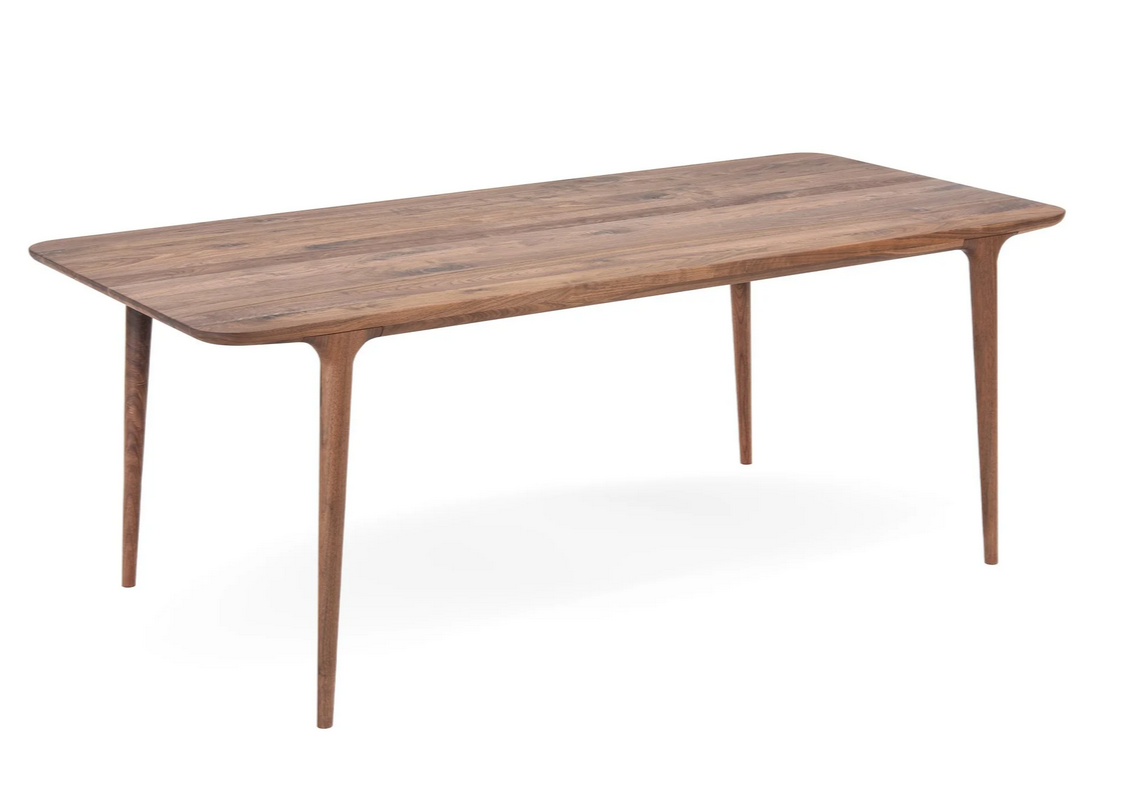 Table Fawn en chêne massif, lignes fluides et sculpturales, élégance intemporelle et durable.